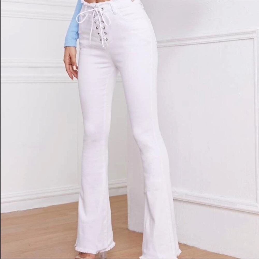 White flare pants with lace up detail